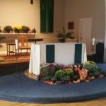 altar decorated with fall flowers
